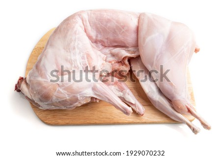 Whole raw rabbit isolated on a white background. Side view, close up.