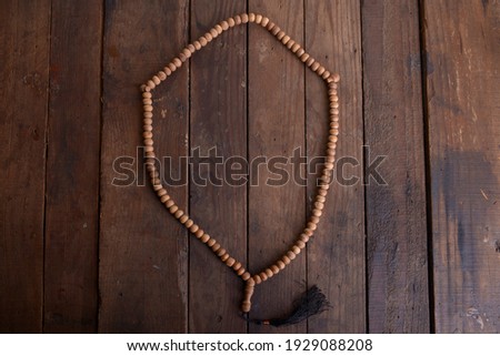 Prayer beads on wooden table