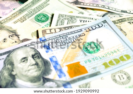 Money, US dollar bills background. Money scattered on the desk. Photography for Finance and Economy concepts. 