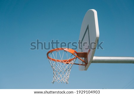 Playing basketball during the day Royalty-Free Stock Photo #1929104903