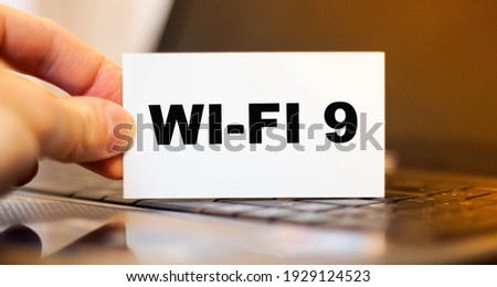 Concept of a man holding a card with secret information about Wi-Fi 9
