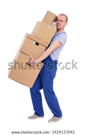 portrait of tired man loader in uniform with heap of boxes isolated on white background