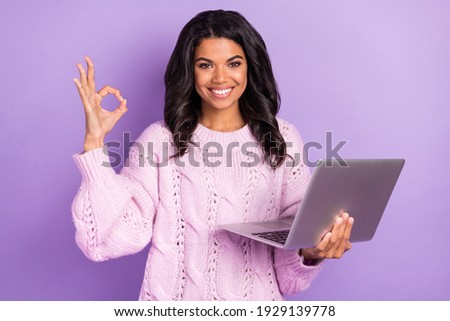 Photo of young cheerful afro girl happy smile use laptop show okey deal done alright sign isolated over purple color background