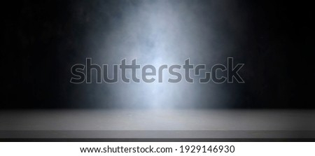 Empty white marble table with smoke float up on dark background for showing or design backdrop.
