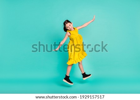 Full size profile photo of optimistic nice brown hair girl jump wear yellow dress isolated on bright teal color background