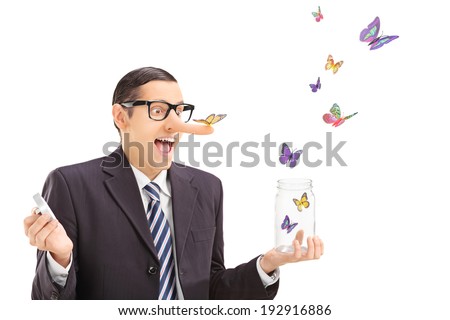 Man looking at butterflies escaping an open jar isolated on white background