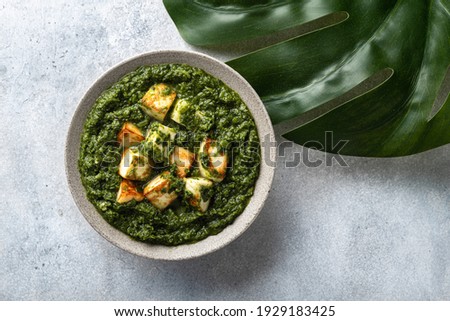 Palak Paneer indian traditional food on concrete background, top view Royalty-Free Stock Photo #1929183425