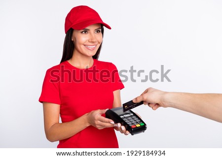 Photo of young happy cheerful lovely service girl hold terminal cashless payment isolated on grey color background