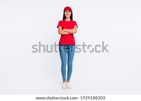 Full size photo of young happy cheerful smiling service delivery girl with folded hands isolated on grey color background