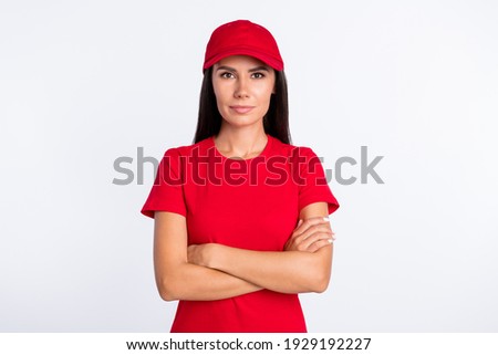 Photo of young happy smiling lovely delivery woman with folded hands professional isolated on grey color background