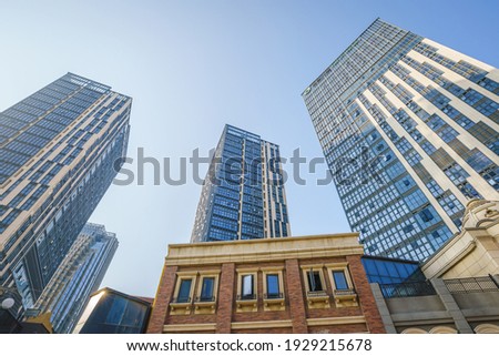 Modern city skyscrapers, glass wall business buildings under the sunlight in Quanzhou, China