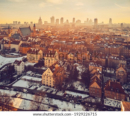 Beautiful panoramic aerial drone skyline sunset view of the Warsaw City Centre with skyscrapers of the Warsaw City and Warsaw's old town with a market square and a mermaid statue, Poland, EU