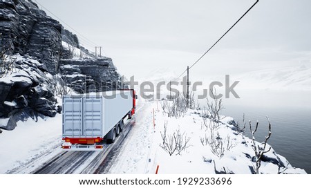 Red truck transport with container on winter road Royalty-Free Stock Photo #1929233696