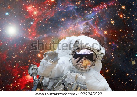 Astronaut posing. The elements of this image furnished by NASA.

