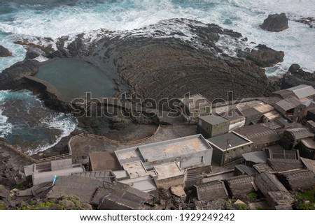 Fishermans houses and natural pools at Pozo de las Calcosas on the island of El Hierro, Canary Islands