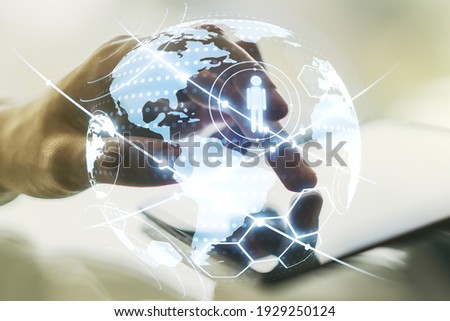Social network media concept with world map and finger presses on a digital tablet on background. Double exposure