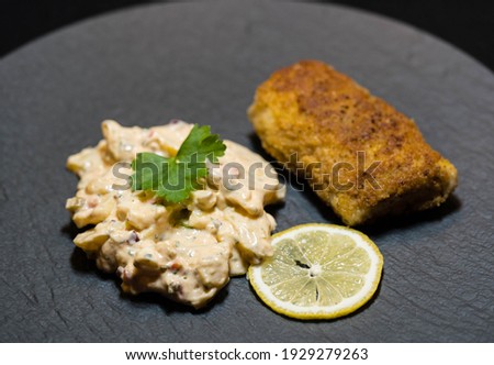 breaded cod fillet with potato salad