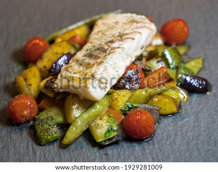 roasted cod fillet on mediterranean vegetables