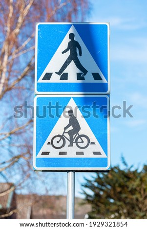 Sign showing pedestrian and bike path crossing