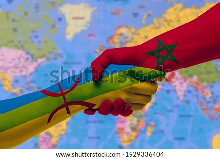 Handshake between Morocco and Berbers-Imazighen - flags painted on hands, illustration with clipping path.
 Royalty-Free Stock Photo #1929336404
