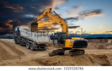 heavy earth mover on construction site Royalty-Free Stock Photo #1929338786