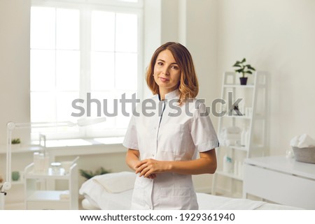Cosmetologist in the cosmetology office. Cosmetologist doctor dermatologist in a beauty clinic. Facial skin treatment. Beauty treatments. Royalty-Free Stock Photo #1929361940