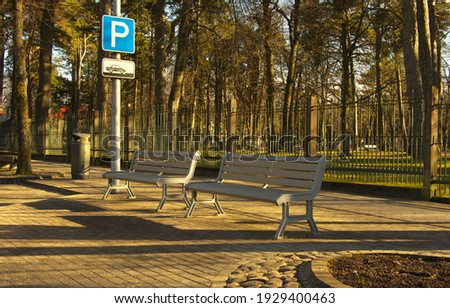 Two benches near the car park and park.
