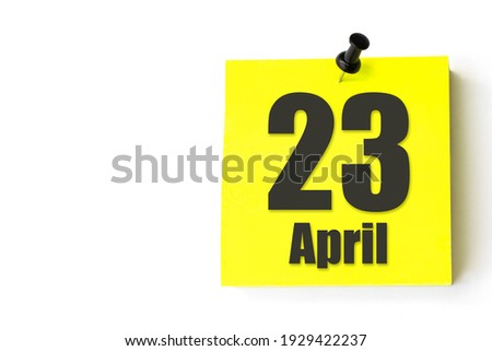 April 23rd. Day 23 of month, Calendar date. Yellow sheet of the calendar. Spring month, day of the year concept