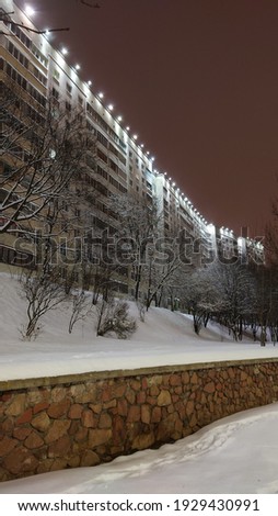 Night photo of panel buildings from the era of modernism. Architectural details. Soviet architecture fragment. 