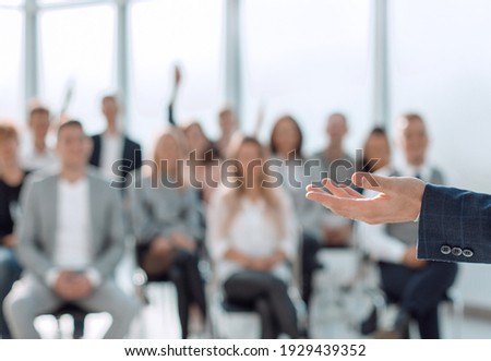 close up. speaker standing in front of the audience in the conference room Royalty-Free Stock Photo #1929439352