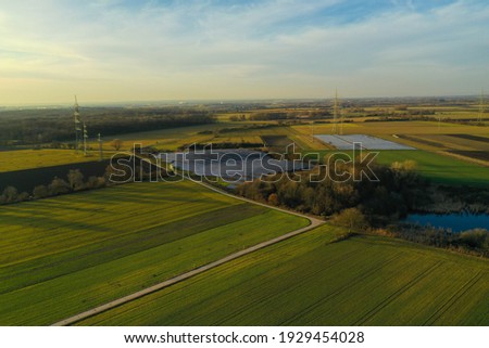 aerial photo of big solar power plant during sunset in the middle of nature sustainable renewable energy