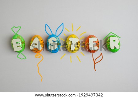 Colored eggs painted on a light background. Easter.