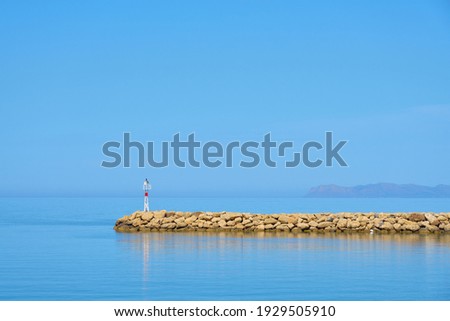 The stone coast of northern Crete on a sunny day. Holidays concept.