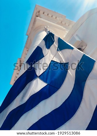 Greek flag on a white church