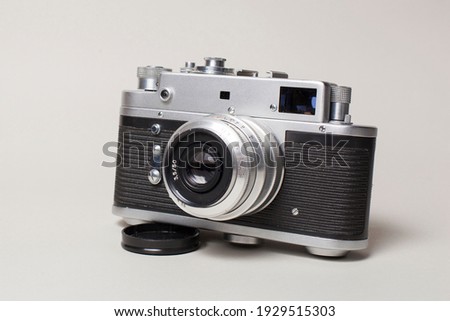 
Antique camera on a light background