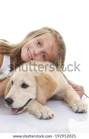 golden labrador dog with young girl