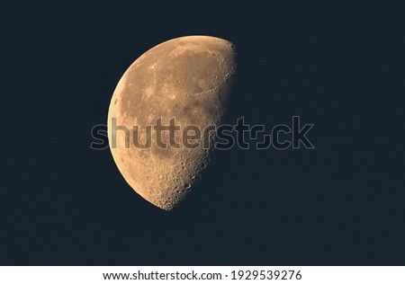 Closeup of half moon on the sky