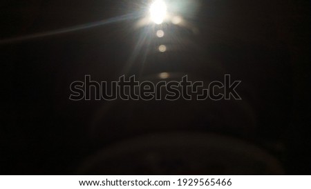Photo of light behind a plastic bottle