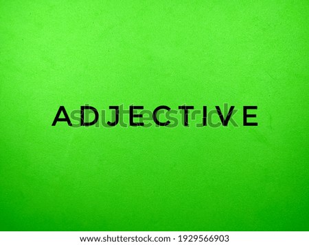 ADJECTIVE word on green background.