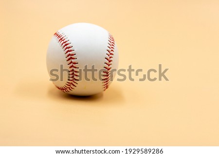 Baseball is on cream background