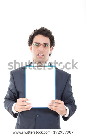 confused and stunned young businessman posing with white board or blank notes