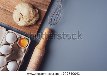 Flat Lay composition, ingredients for baking cookies on a gray background, copy space. Making cookies or cupcakes for Valentine's Day, Mother's Day, Father's Day. 
