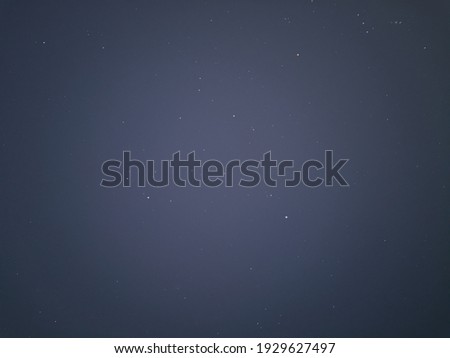 Astrophotography picture of night sky with hundreds of stars visible.