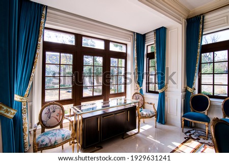 An indoor sitting area near a window