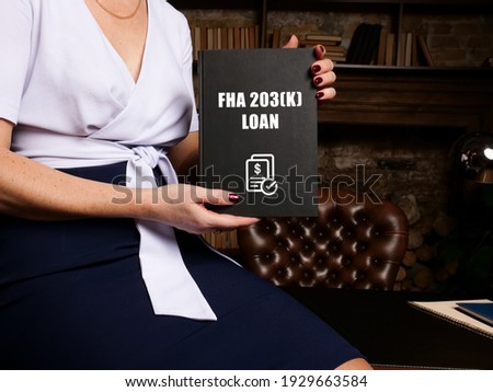 Business concept meaning FHA 203(K) LOAN with phrase on black notepad. 
