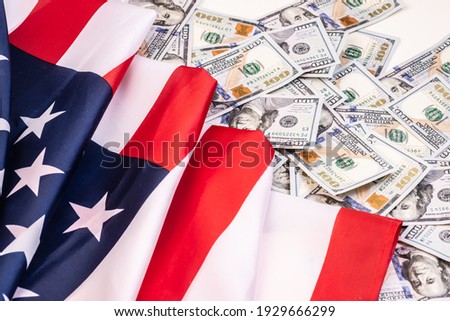United States of America waving flag with many folds 100 dollar bills  ,joe biden 2021 Royalty-Free Stock Photo #1929666299