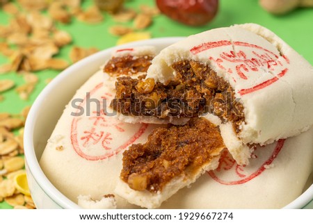 Jujube paste walnut cake with solid color background,枣泥核桃It means jujube paste and walnut