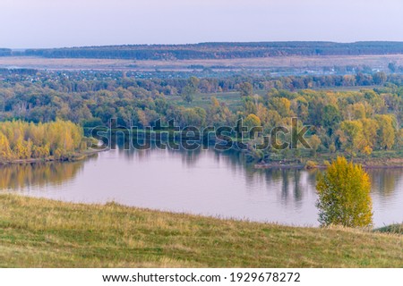 Summer landscape of the river. Sunrise sunset. every day on planet Earth can begin serene with the rising of the sun, when the sky gently brightens over the golden eastern horizon.