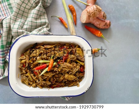Flat lay of Spicy Shredded Tuna Fish (Pindang Tongkol  Suwir Pedas - Indonesia) is an Indonesia food. It is from smoked fish, chillies, spices and herbs.