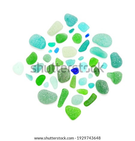 Pieces of green and blue seaglass on white background Royalty-Free Stock Photo #1929743648